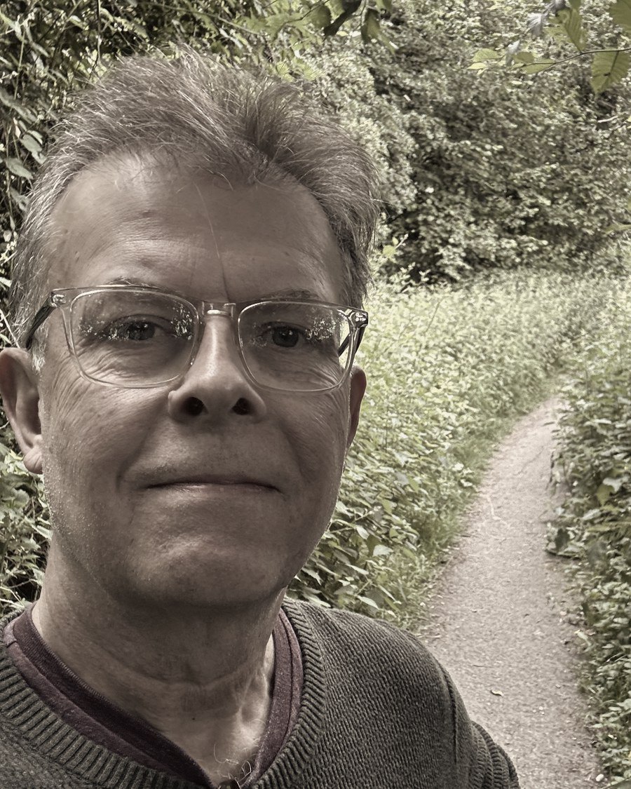Siegfried Martens on a wooded path